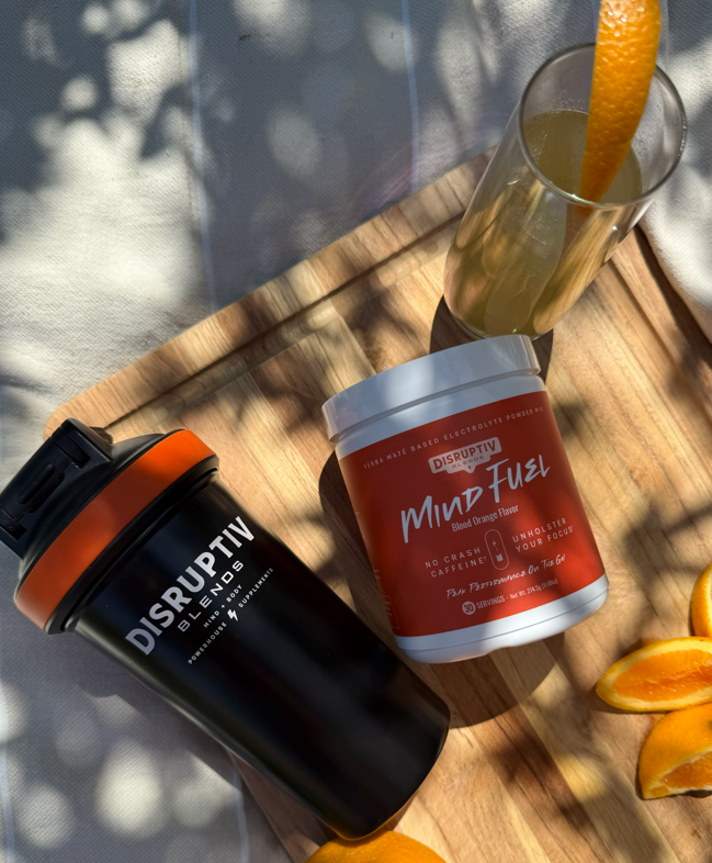 Blood Orange 05 - Mind Fuel Blood Orange tub and Disruptiv shaker on a wooden tray