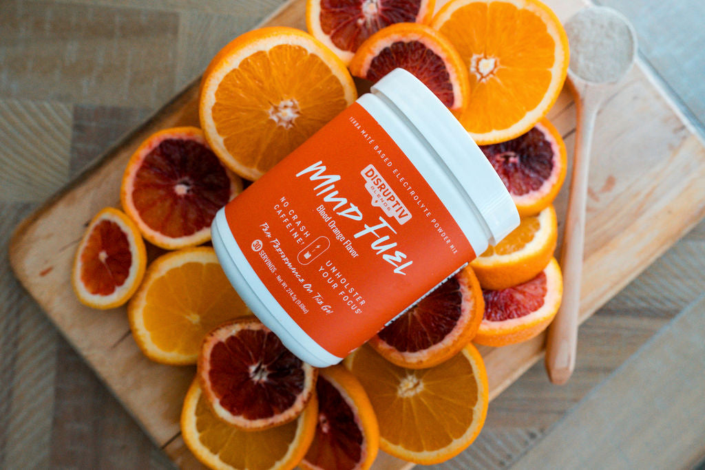 Blood Orange below 2 - Mind Fuel Blood Orange tub on a board of sliced citrus
